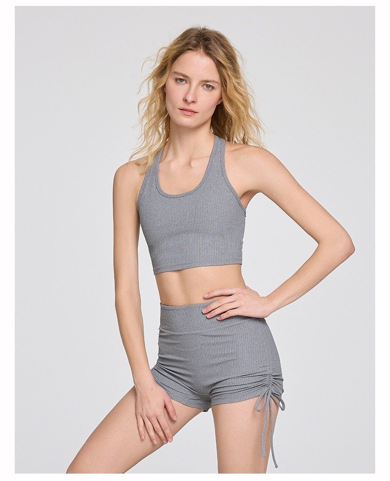 Woman wearing a seamless yoga set, demonstrating movement